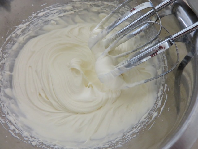 whipped cream frosting at stiff peaks